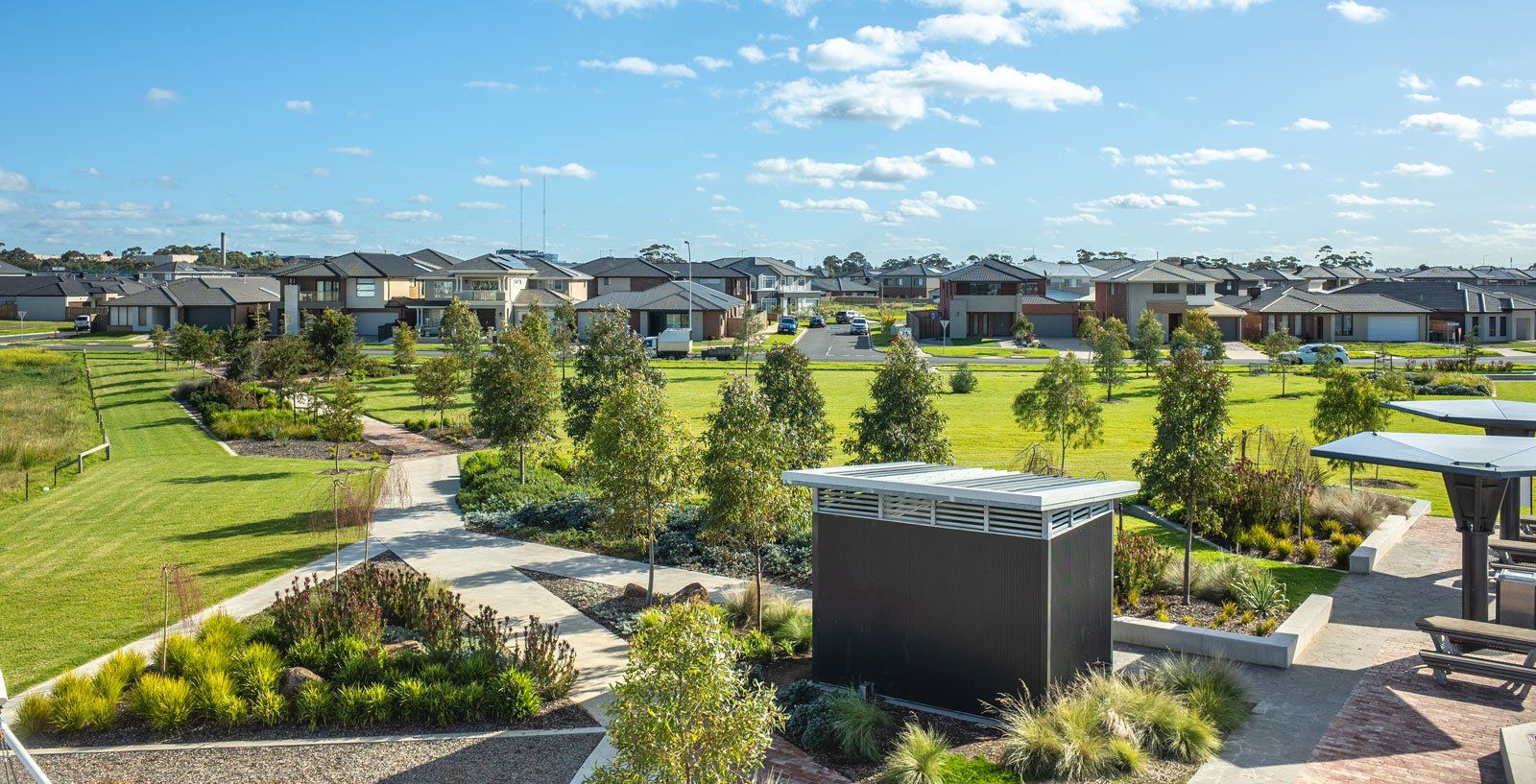 Newly established subdivision streetscape by Advanced Landscaping - open space, tree planting and pathways