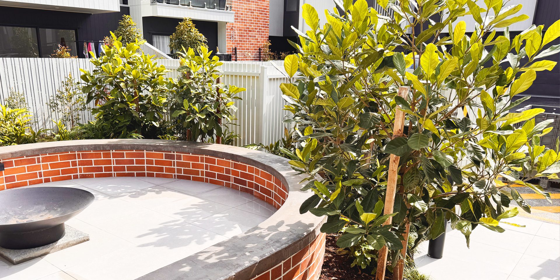 Established planting and hardscape maintained in a commercial common area